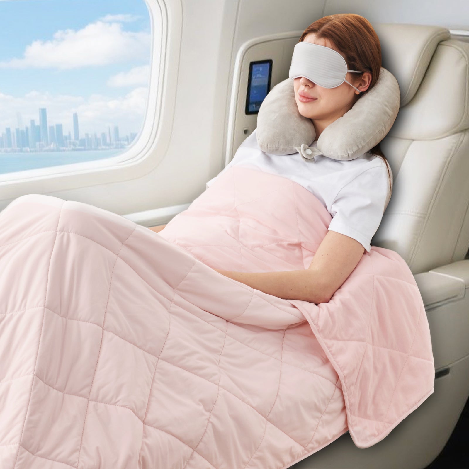 Women sleeping on an airplane with a neck pillow and pink blanket.#color_Pink