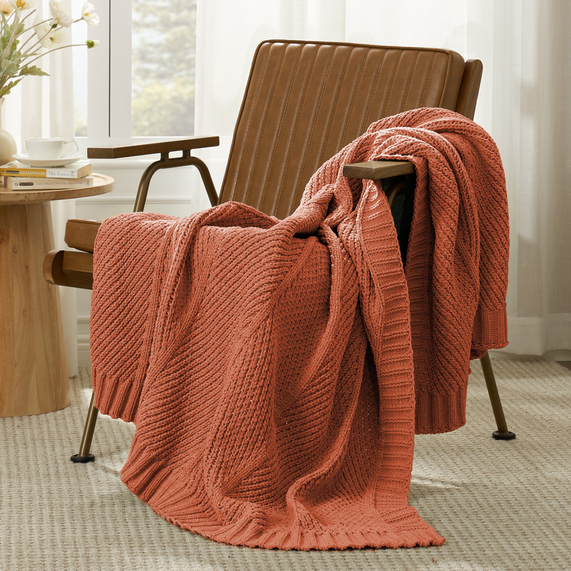 Snuggle Sac chevron chenille knit throw blanket in Burnt Orange casually draped over a chair in a cozy setting #color_Burnt Orange