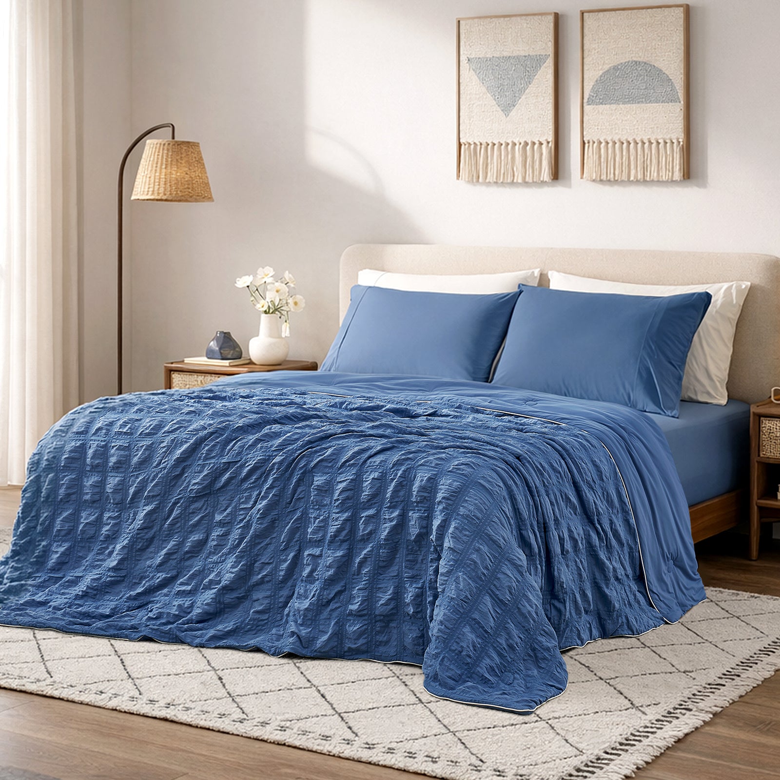 Snuggle Sac Cooling comforter in dark blue on bed in a bedroom with window,plant and a view behind#color_Dark Blue