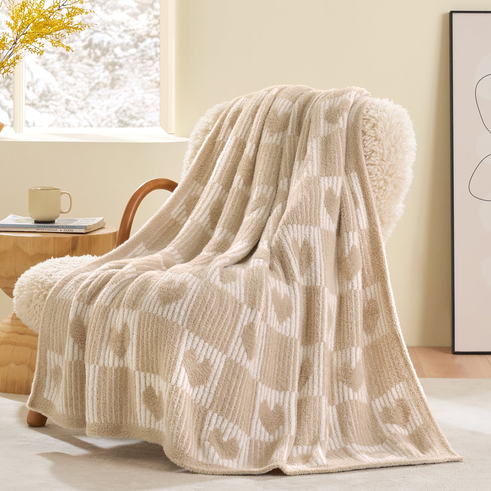 Beige patterned throw blanket draped over a chair in a cozy room. #color_Cream/Beige