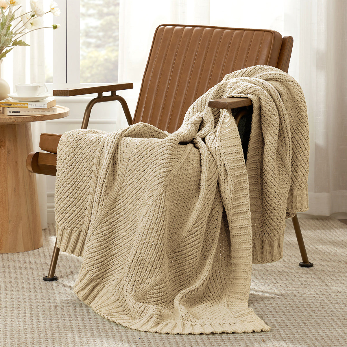 Chevron chenille knit throw blanket in Beige casually draped over a chair in a cozy setting #color_Beige