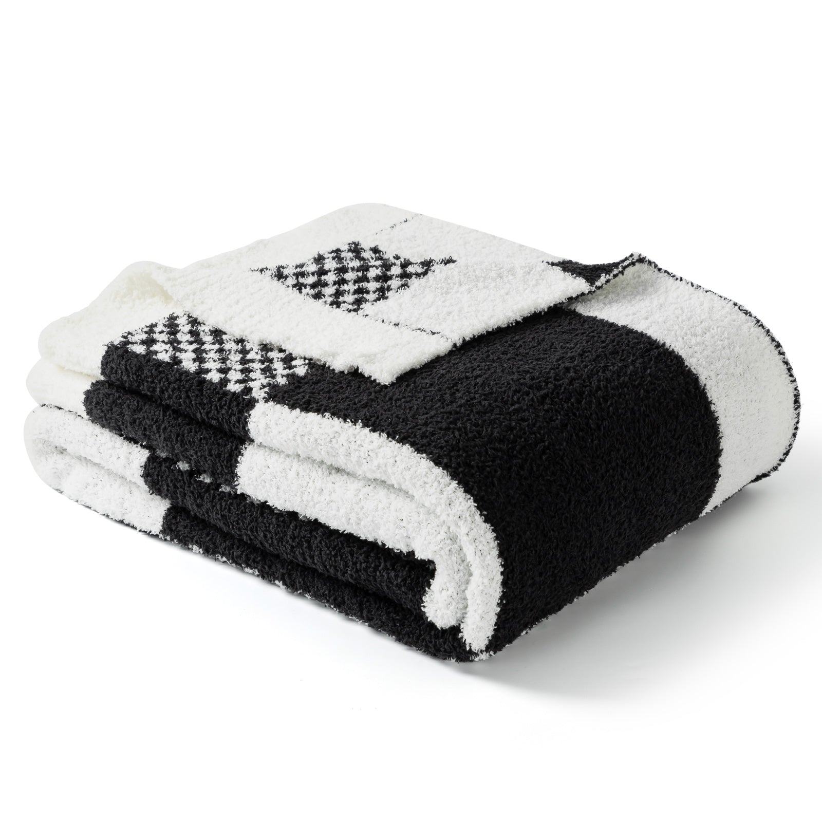 Folded black and white checkered blanket on a white background #color_Black White