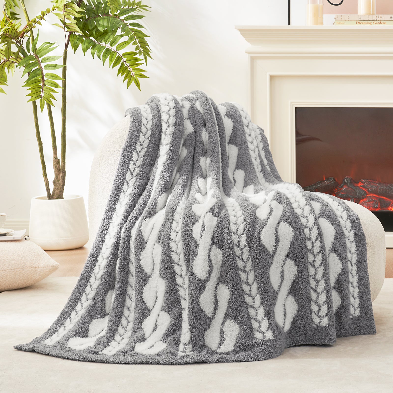 Cable pattern Faux Fur Knit Throw Blanket in gray and white showing the front side.#color_Gray