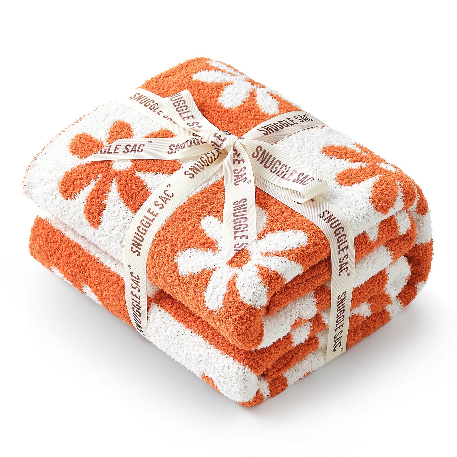 Orange and white blanket with floral patterns and 'Snuggle Sac' branding on a white background #color_Orange