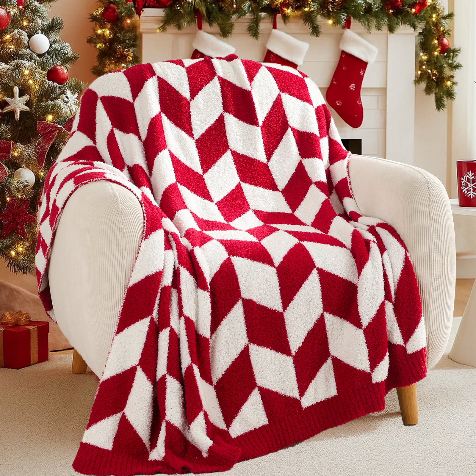 Red and white chevron patterned blanket draped over a chair in a festive living room with Christmas decorations. #color_Red