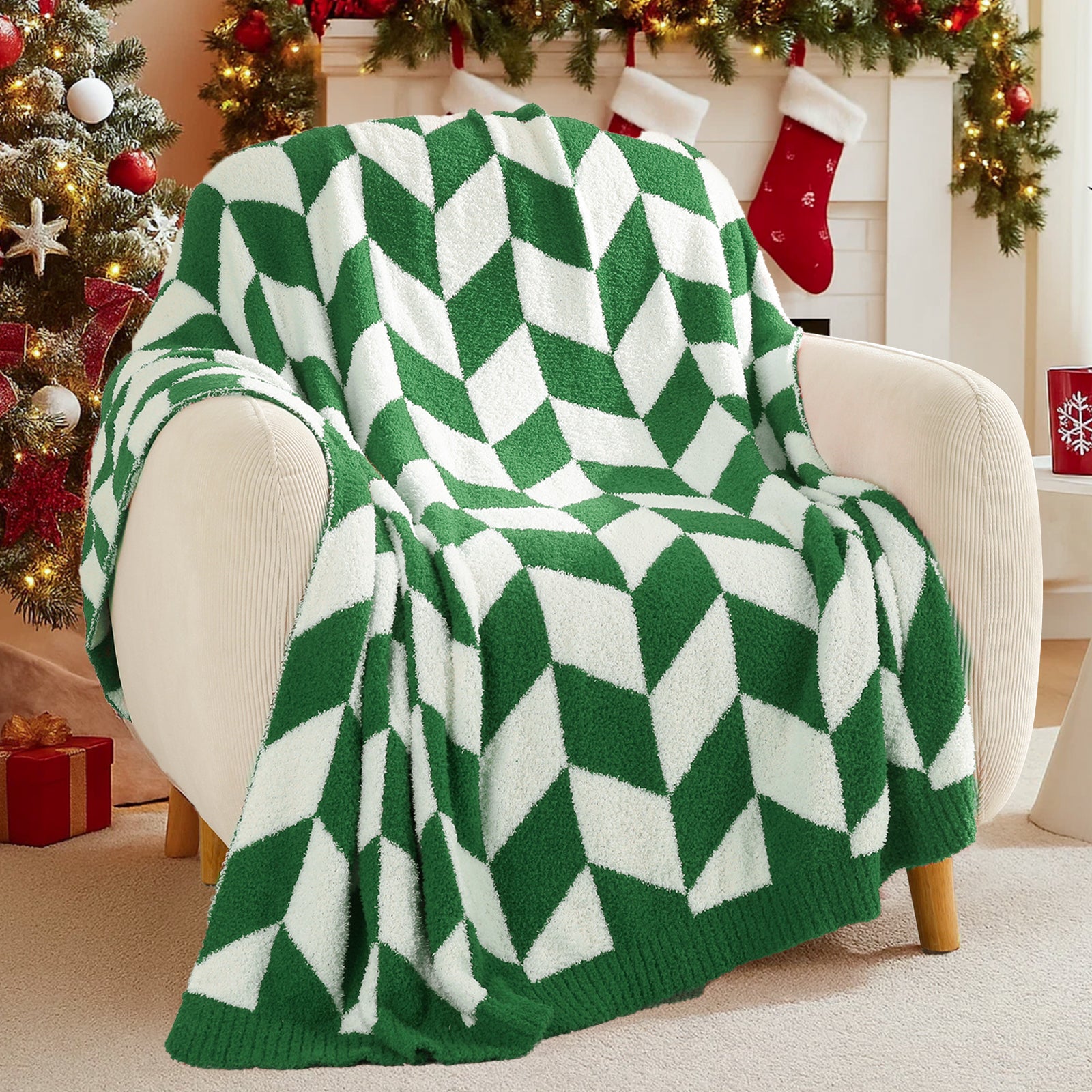 Green and white diamond patterned blanket draped over a chair in a festive room with Christmas decorations. #color_ Xmas Green