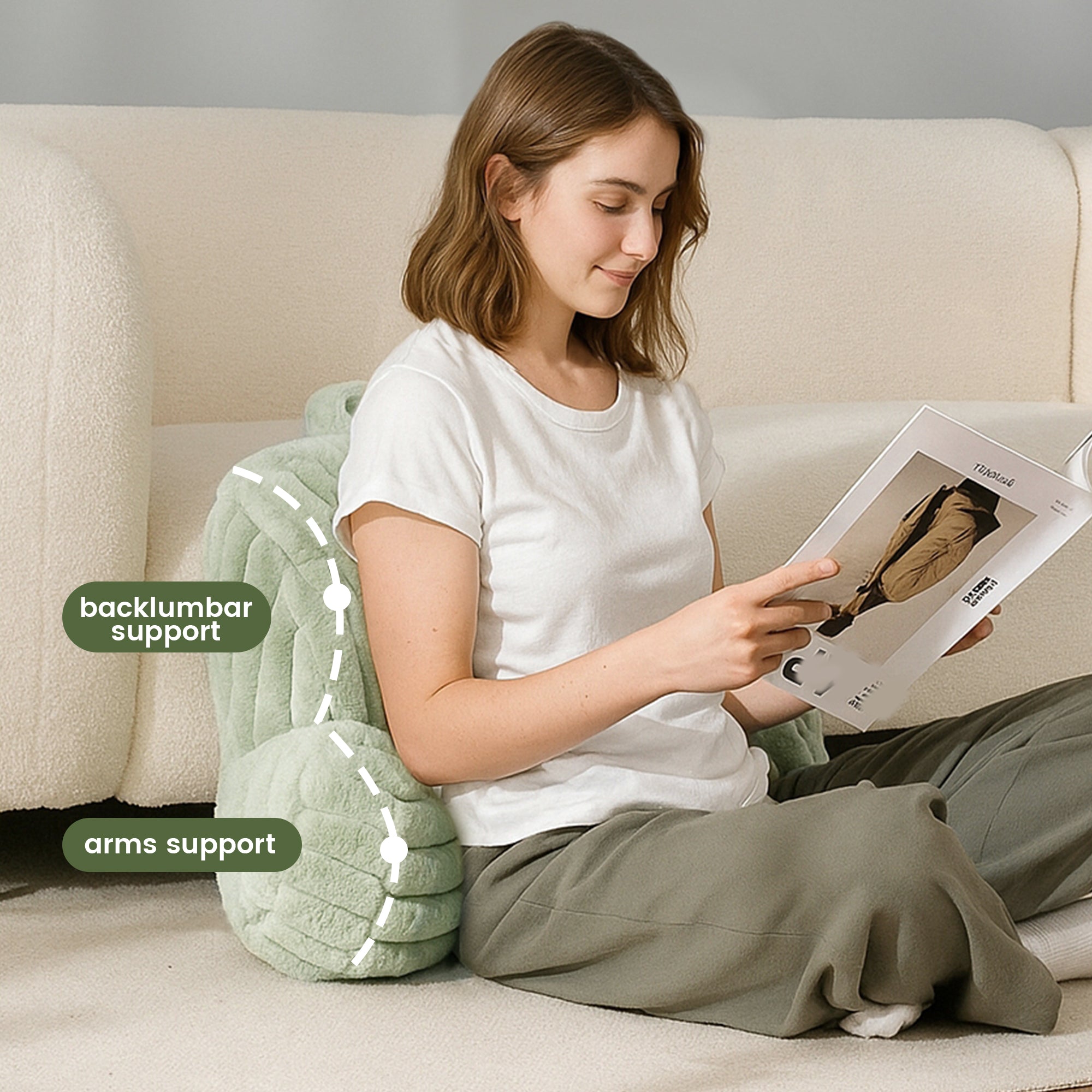A woman sitting on the floor supported by Striped Faux Fur Backrest Reading Pillow reading a magazine#color_Sage Green