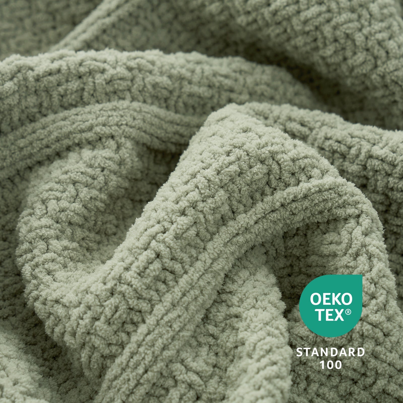 Close-up of a textured green fabric with OEKO-TEX Standard 100 logo. #color_Sage Green