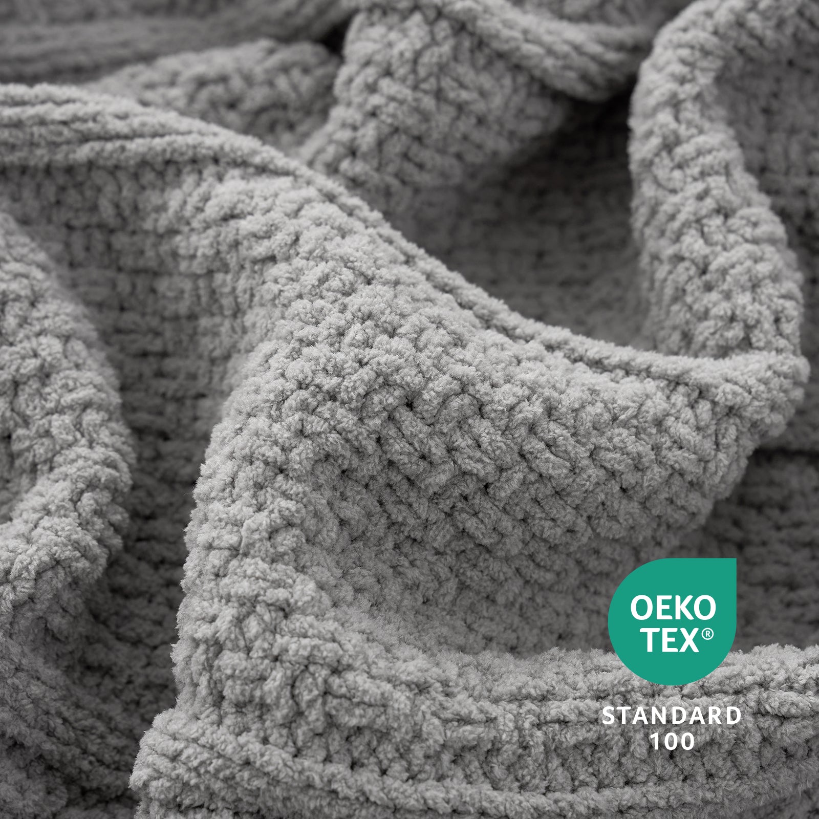 Close-up of a textured gray fabric with Oeko-Tex Standard 100 logo. #color_Gray