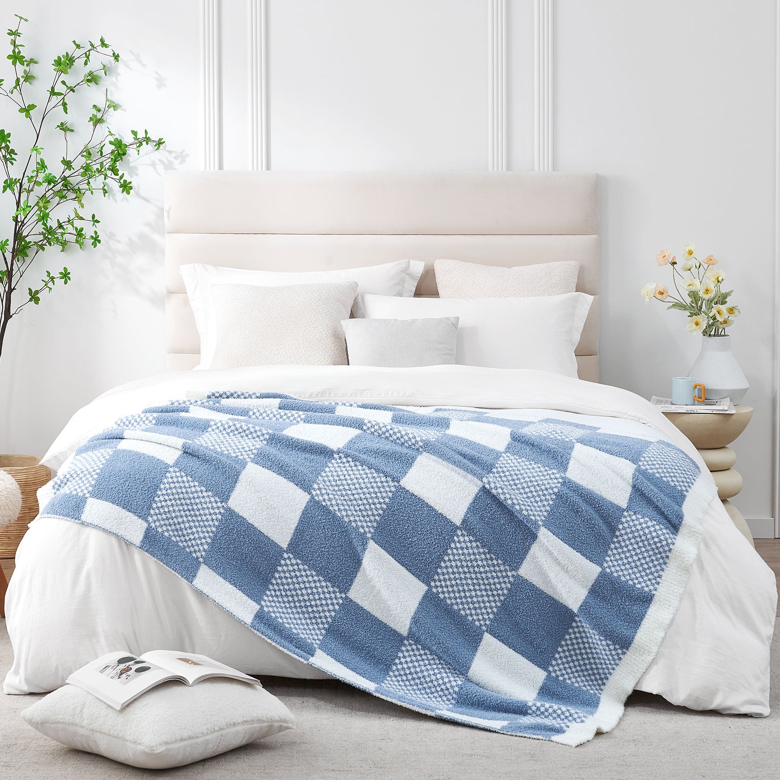 Blue and white checkered blanket on a bed in a bedroom setting #color_Pale Blue