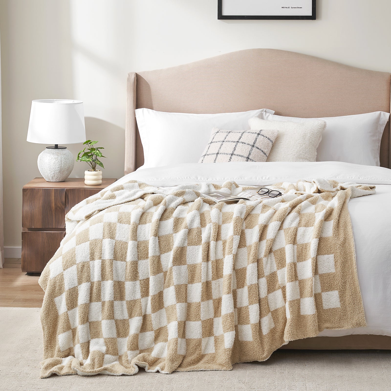 Beige and white checkered blanket on a bed in a bedroom setting. #color_Checkered Beige