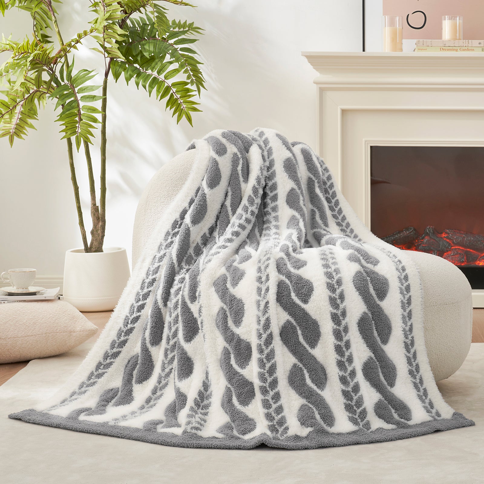 Cable pattern Faux Fur Knit Throw Blanket in grey and white showing the back side.#color_Gray