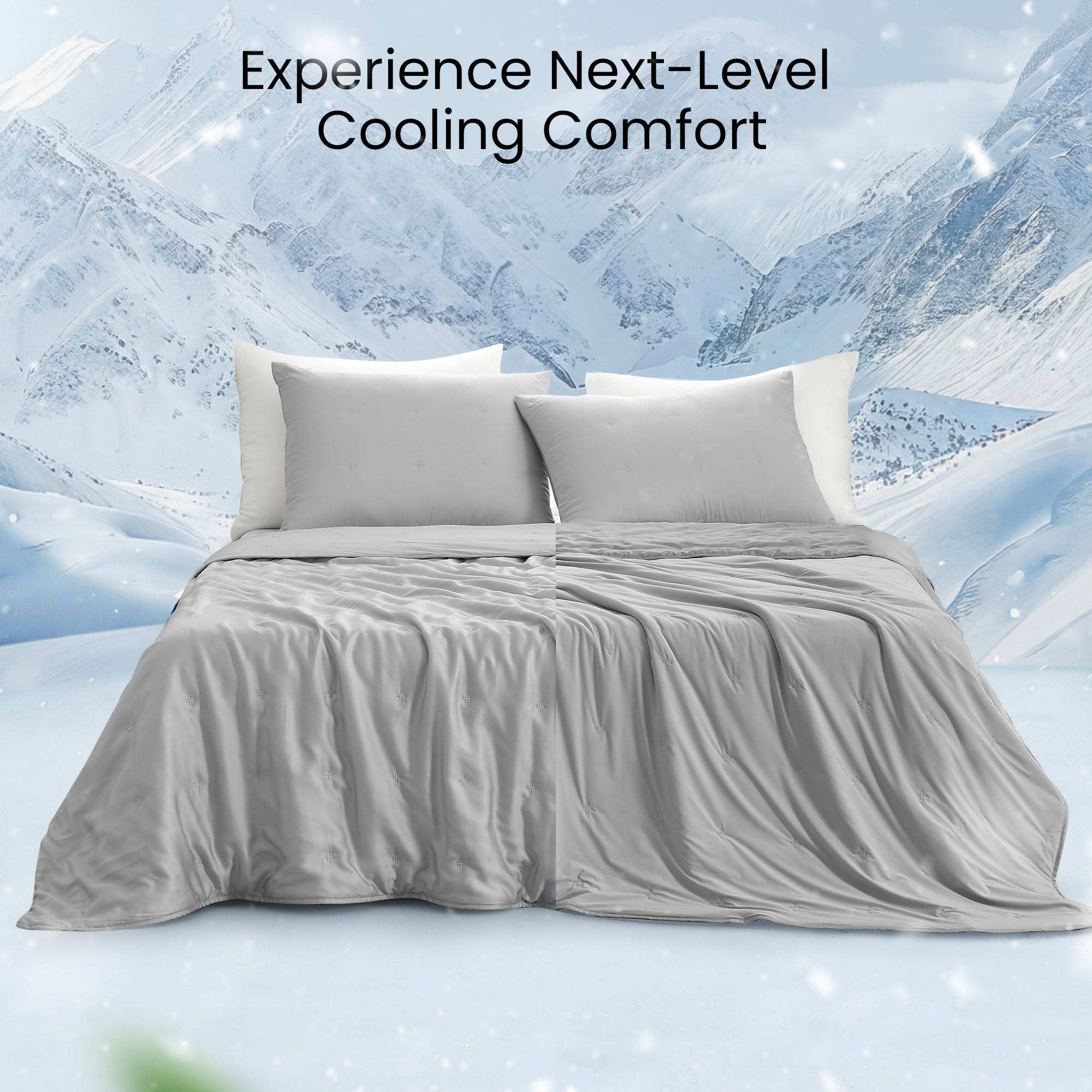 Snuggle Sac Cooling comforter in grey on bed in a bedroom with a view of mountains in snow behind#color_Grey