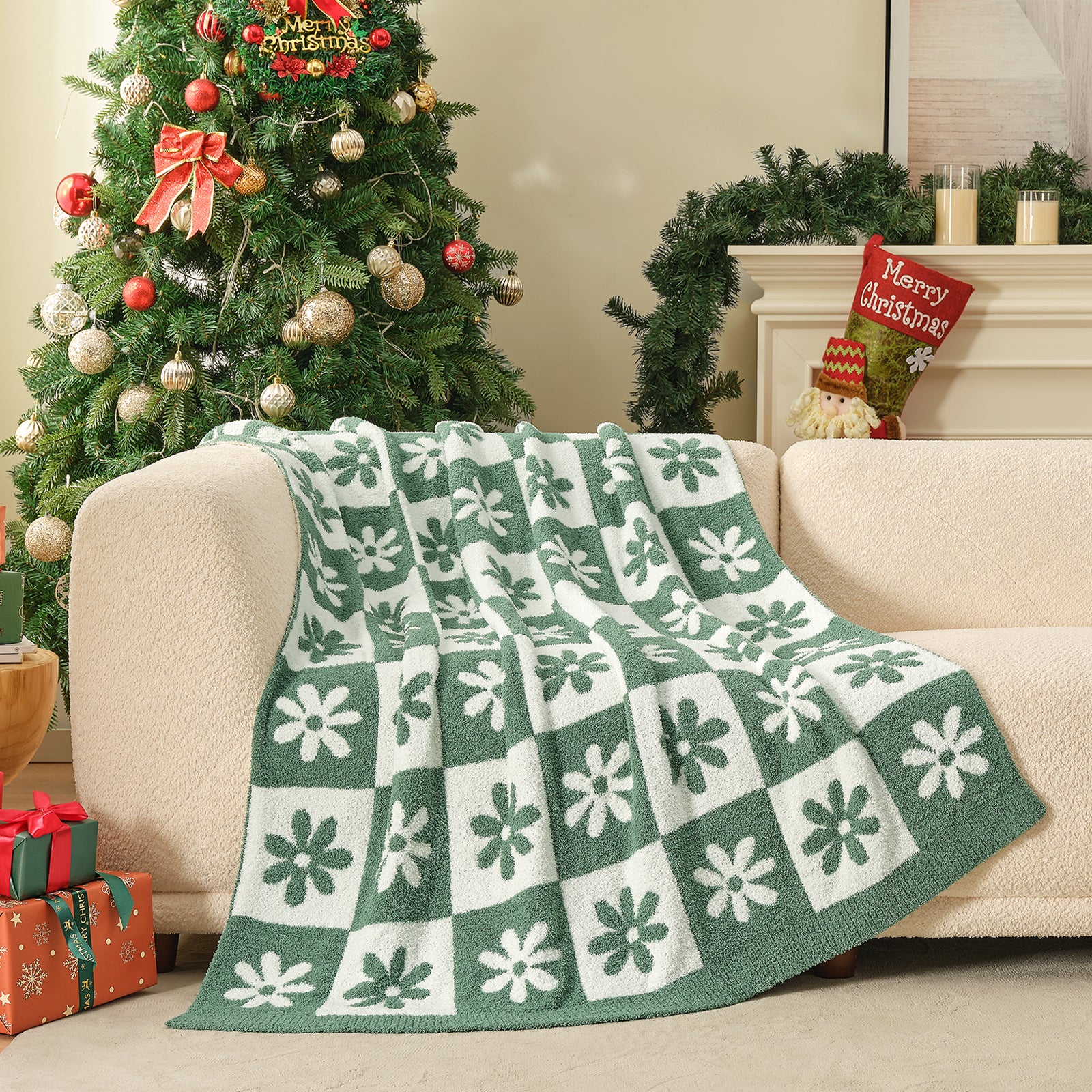 Green and white patterned blanket draped over a couch with a decorated Christmas tree in the background. #color_Xmas Green