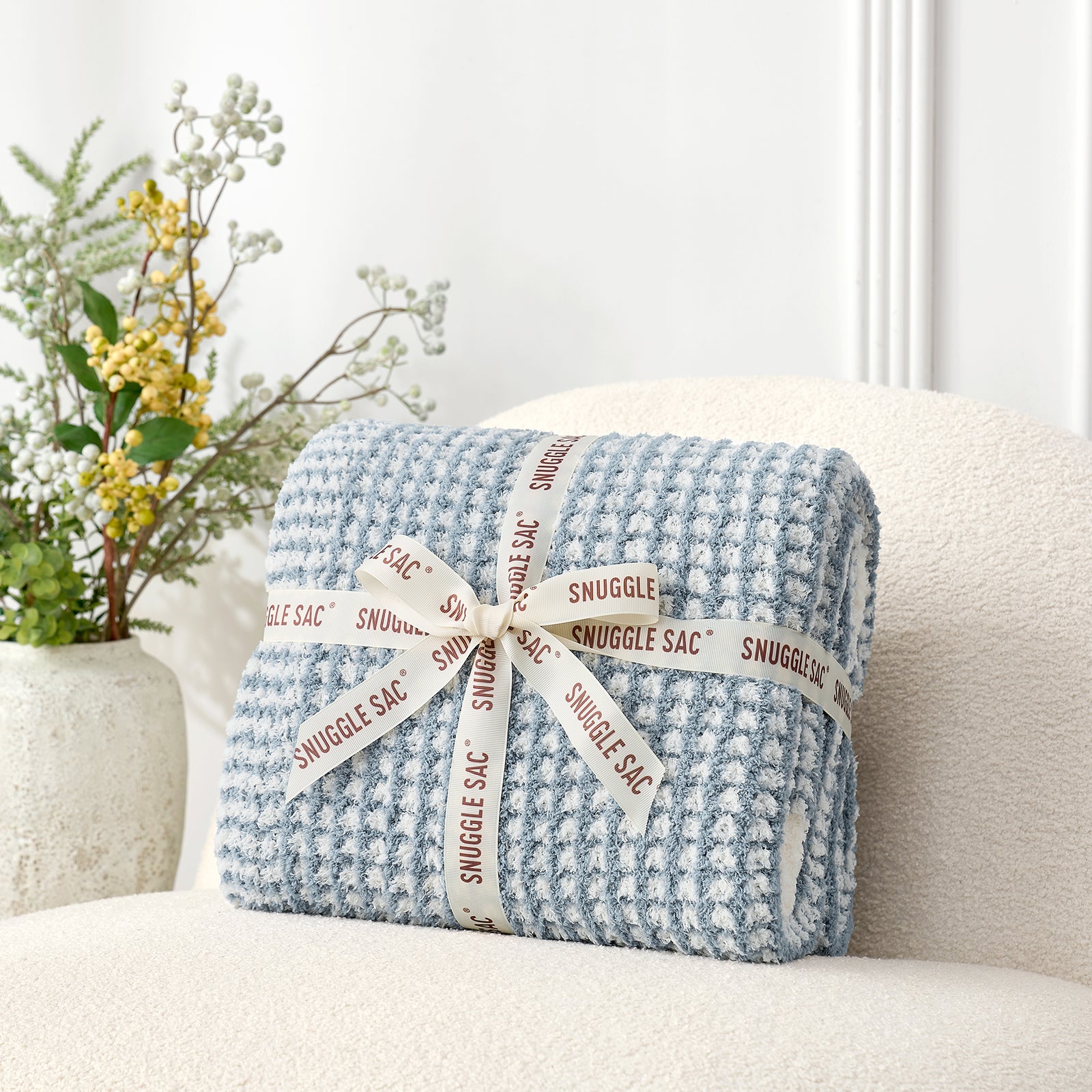 Soft Waffle Feather Yarn Knit Throw Blanket wrapped as a perfect gift with ribbon#color_Cream/Blue