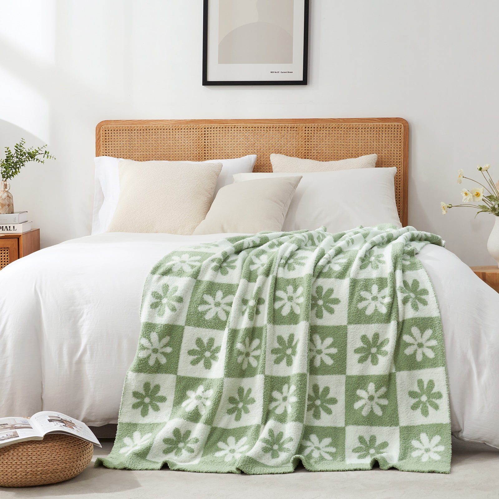 Bed with a green and white checkered blanket, white pillows, and a wooden headboard. #color_Sage Green
