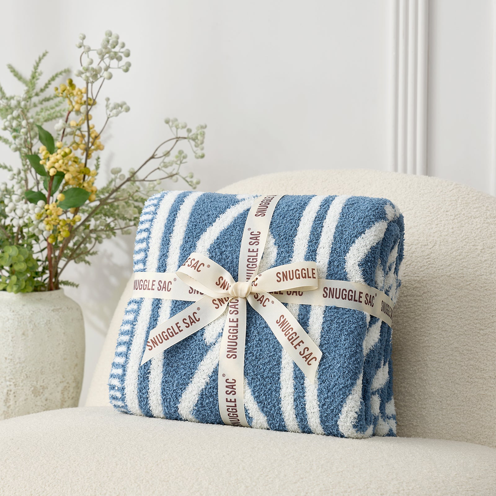 Snuggle Sacs Aesthetic Boho Feather Yarn Knit Throw Blanket, wrapped as a perfect gift. #color_Blue