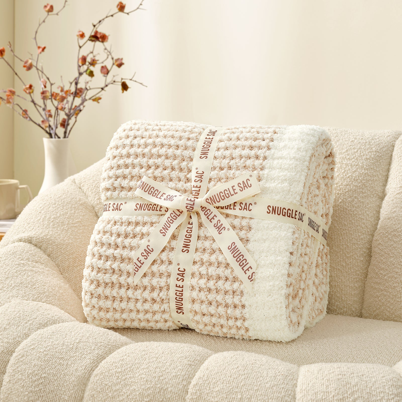 Soft Waffle Feather Yarn Knit Throw Blanket wrapped as a perfect gift with ribbon#color_Cream/Beige