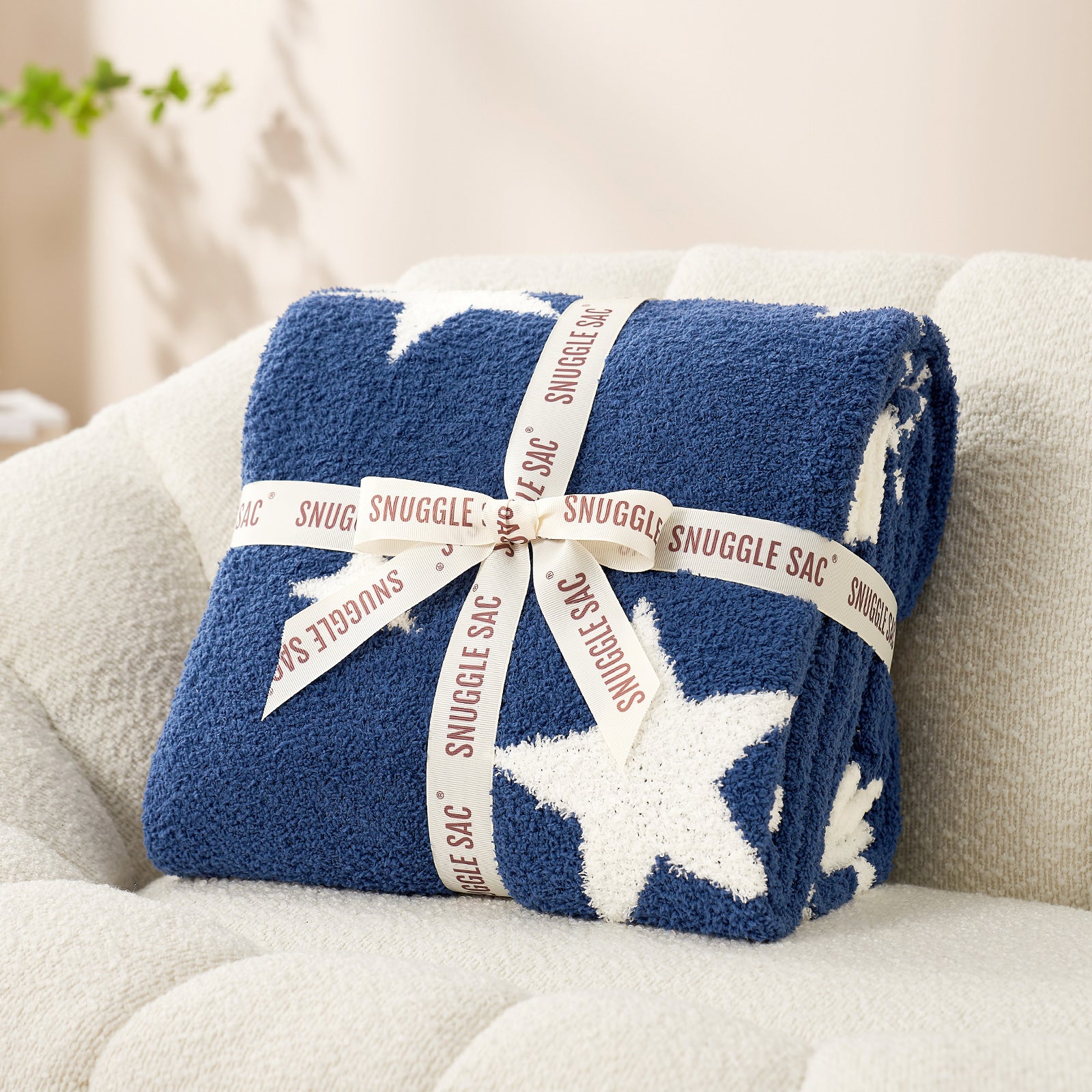Snuggle Sacs Reversible Star Feather Yarn Knit Throw Blanket wrapped as a perfect gift in ribbon#color_Royal_Heather_Blue