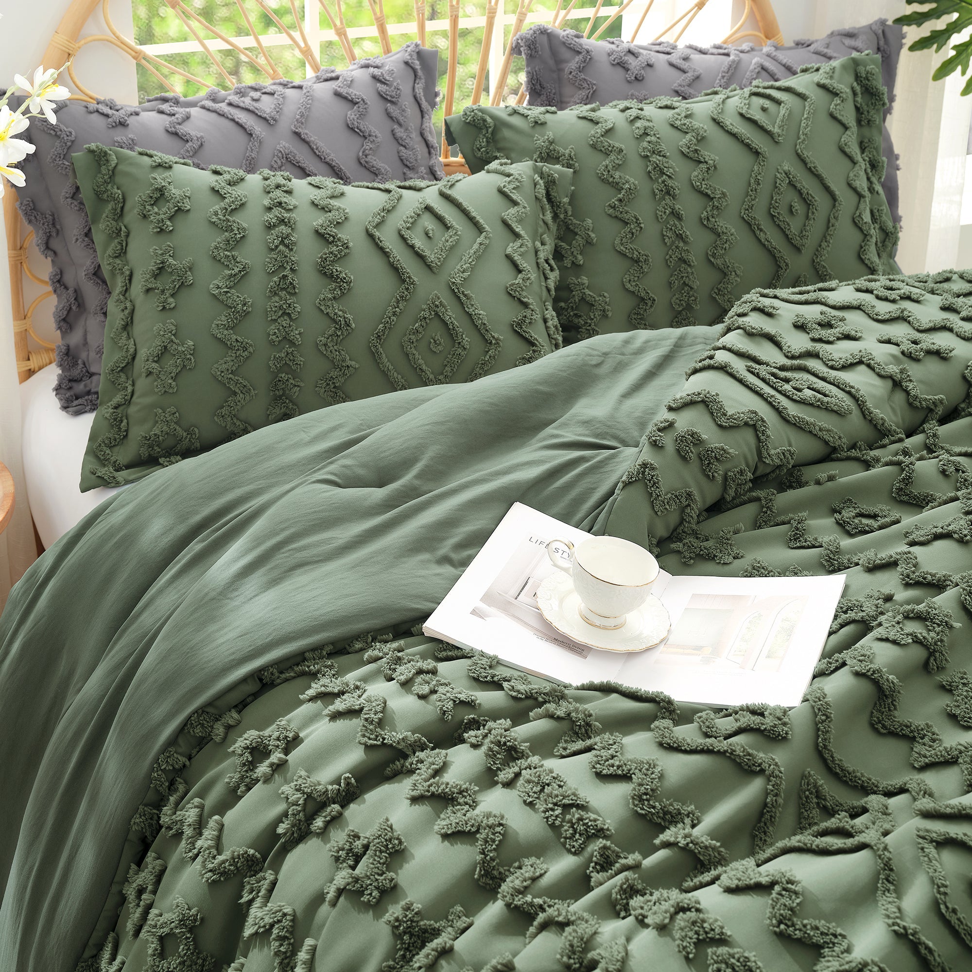close up of Snuggle Sac All-Season Boho Deluxe Embroidery Comforter Set on bed with tea sets#color_Oliver Green