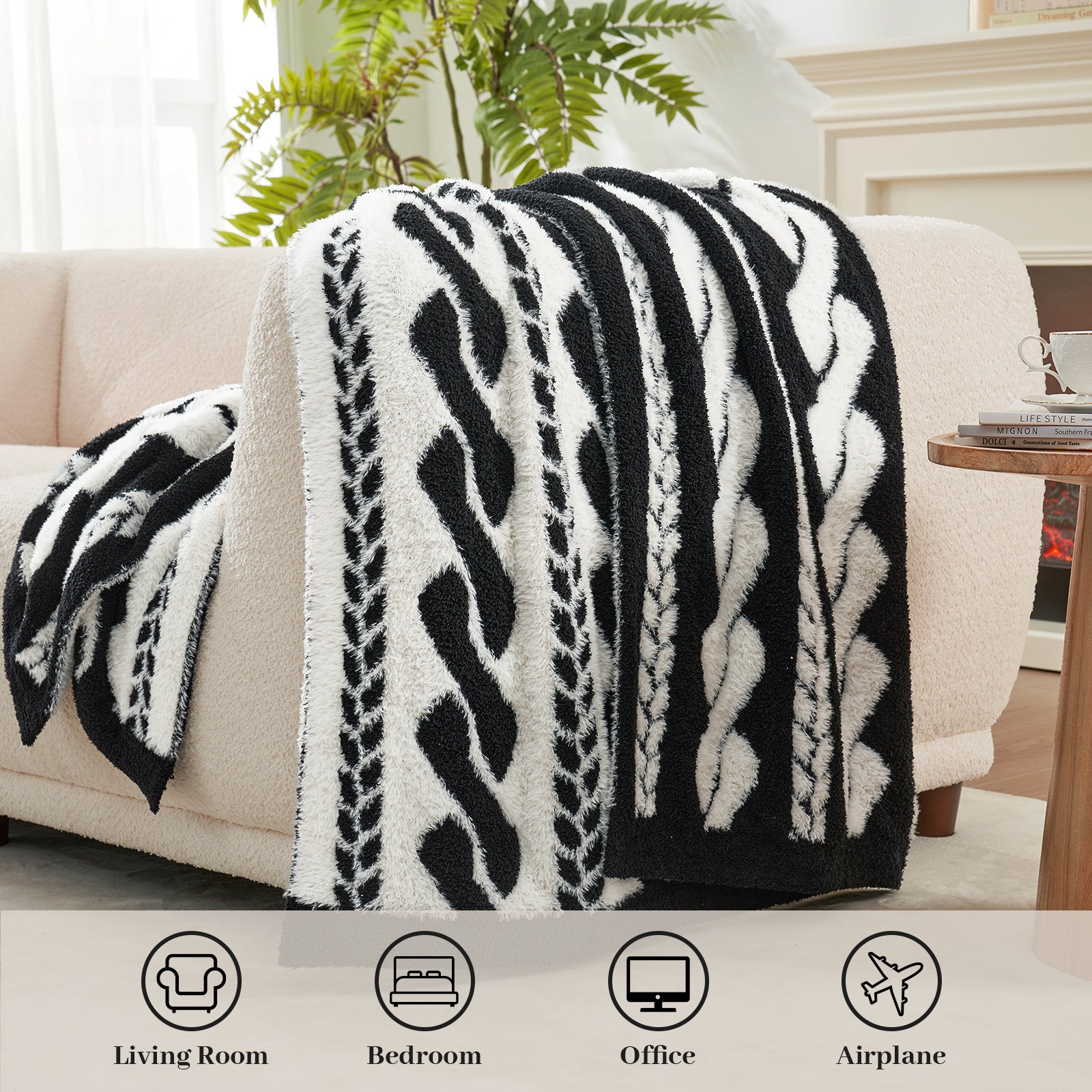 Cable pattern Faux Fur Knit Throw Blanket in black and white front view. draped over a couch. Perfect for Any Occasion.#color_Black