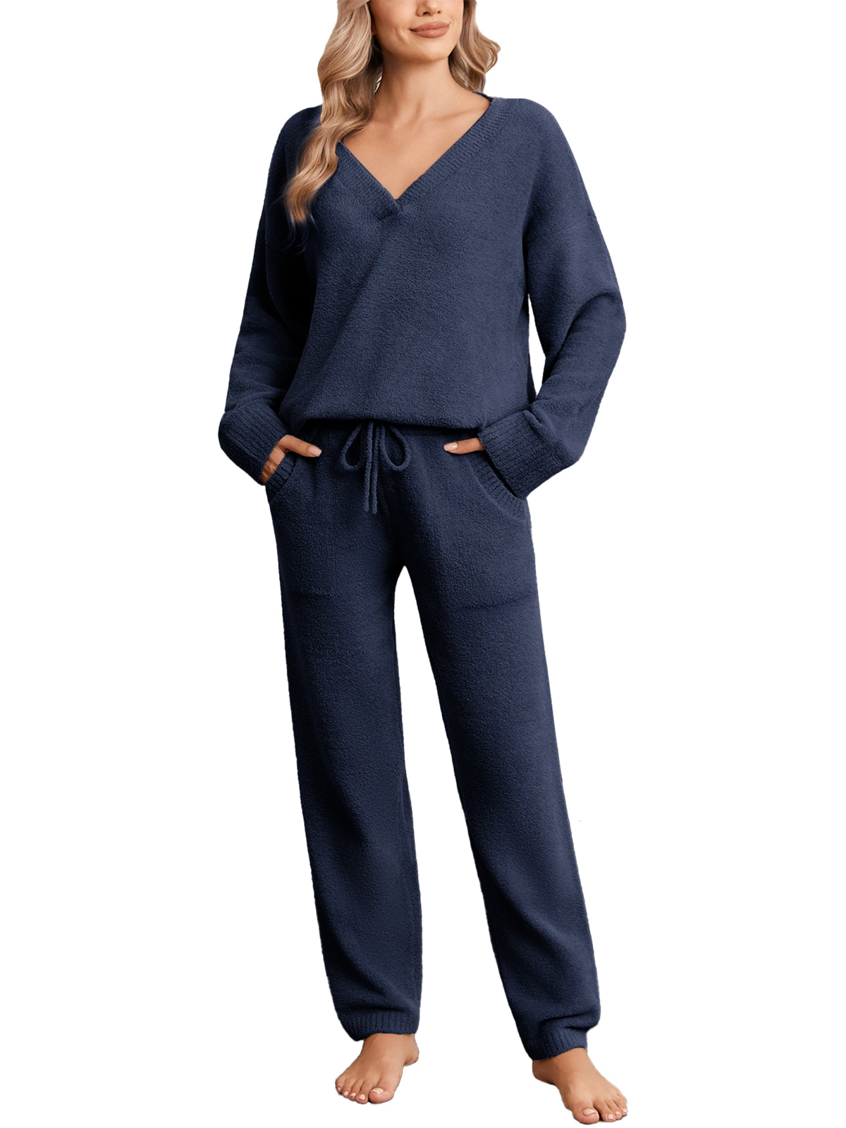 Woman wearing a navy blue pajama set on a white background #color_Navy
