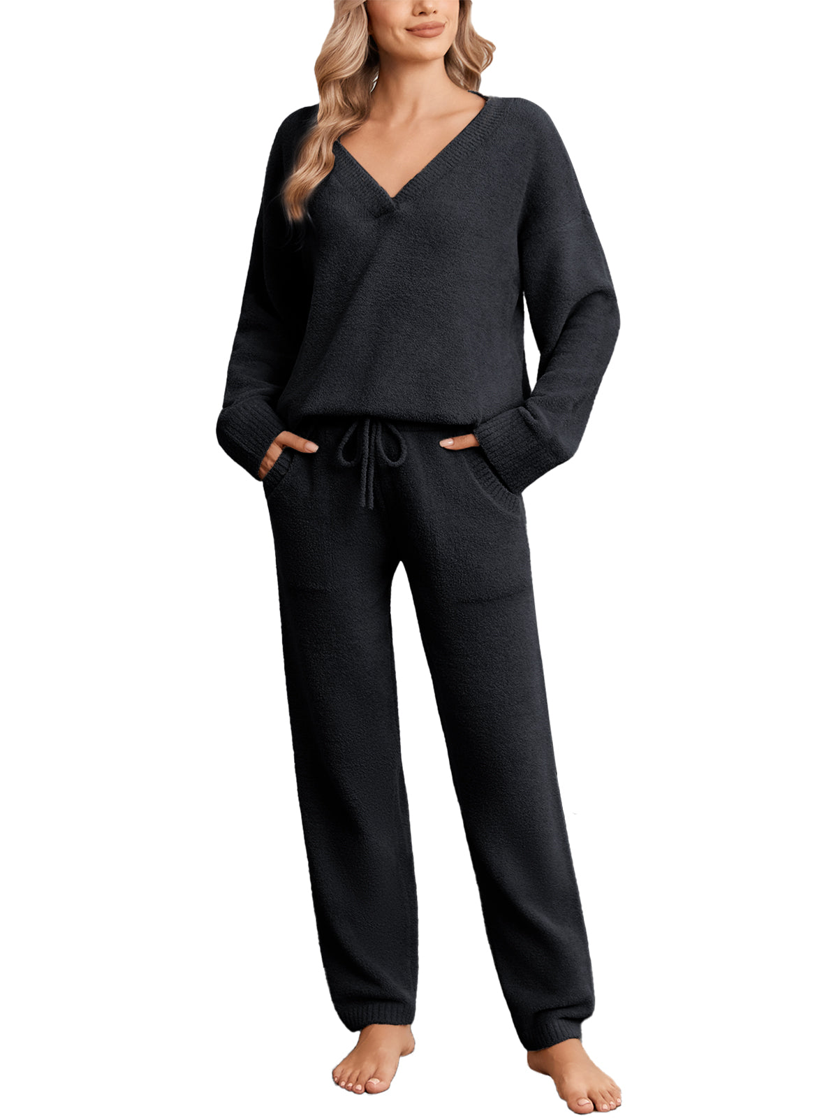 Woman wearing a black pajama set on a white background #color_Black