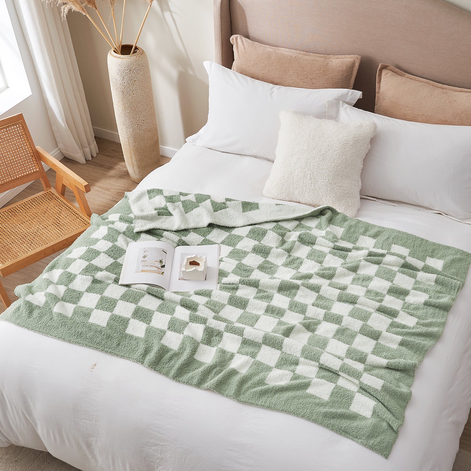 Bed with green and white checkered blanket and pillows in a bedroom setting. #color_Checkered Sage Green