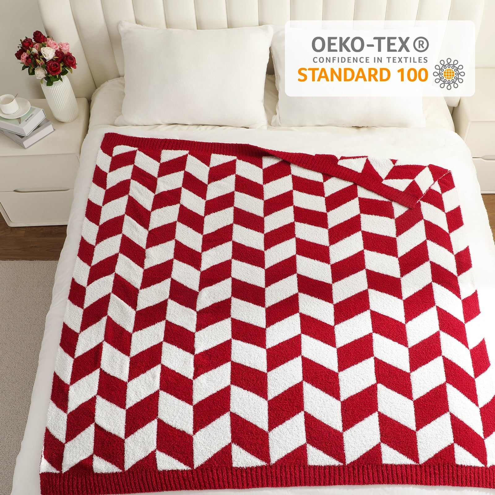 Red and white chevron patterned blanket on a bed with OEKO-TEX certification above.#color_Red/Cream