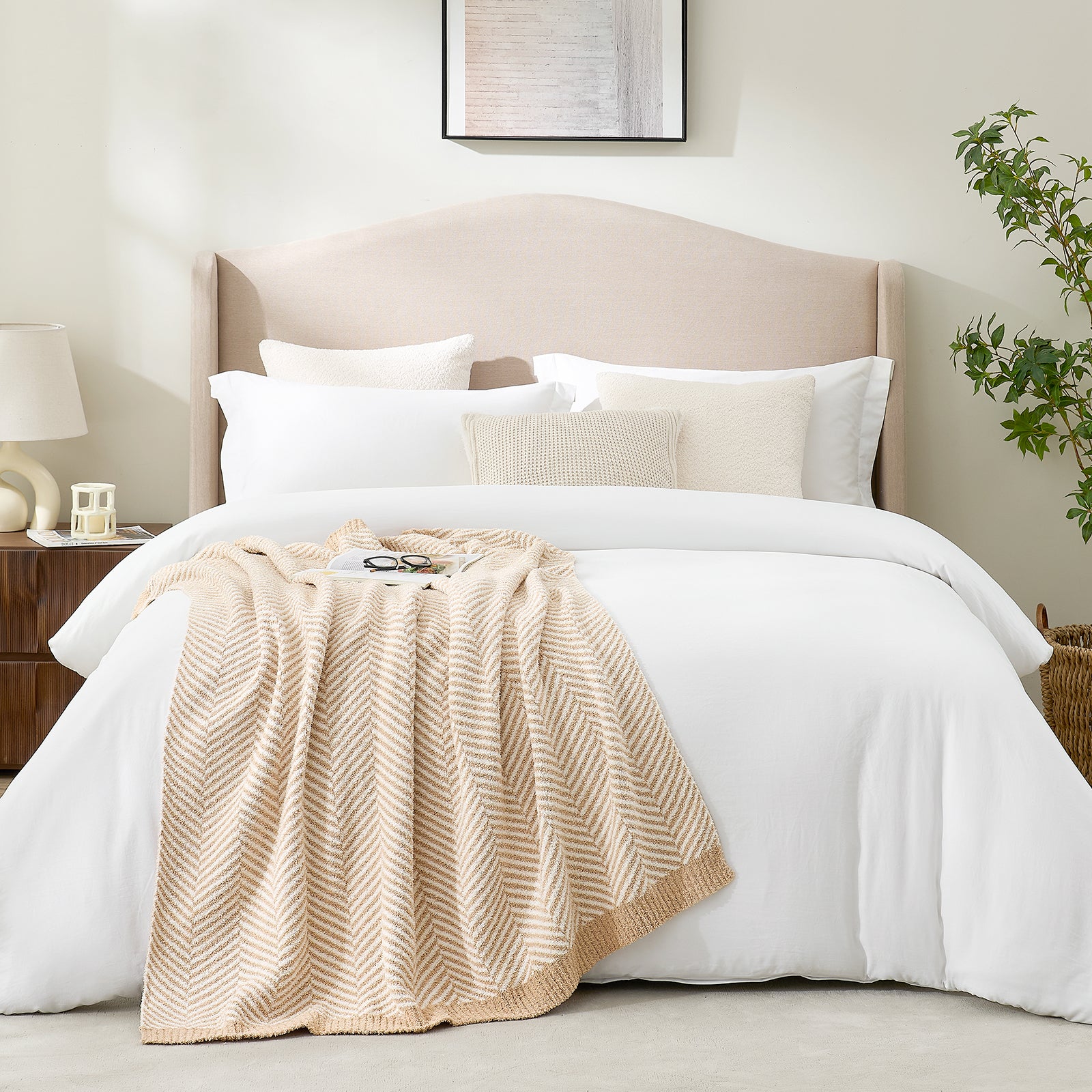 Snuggle Sacs Herringbone Feather Yarn Knit Throw Blanket on the bed with glasses and magazine on the blanket and plant and furnitures in the room#color_Beige