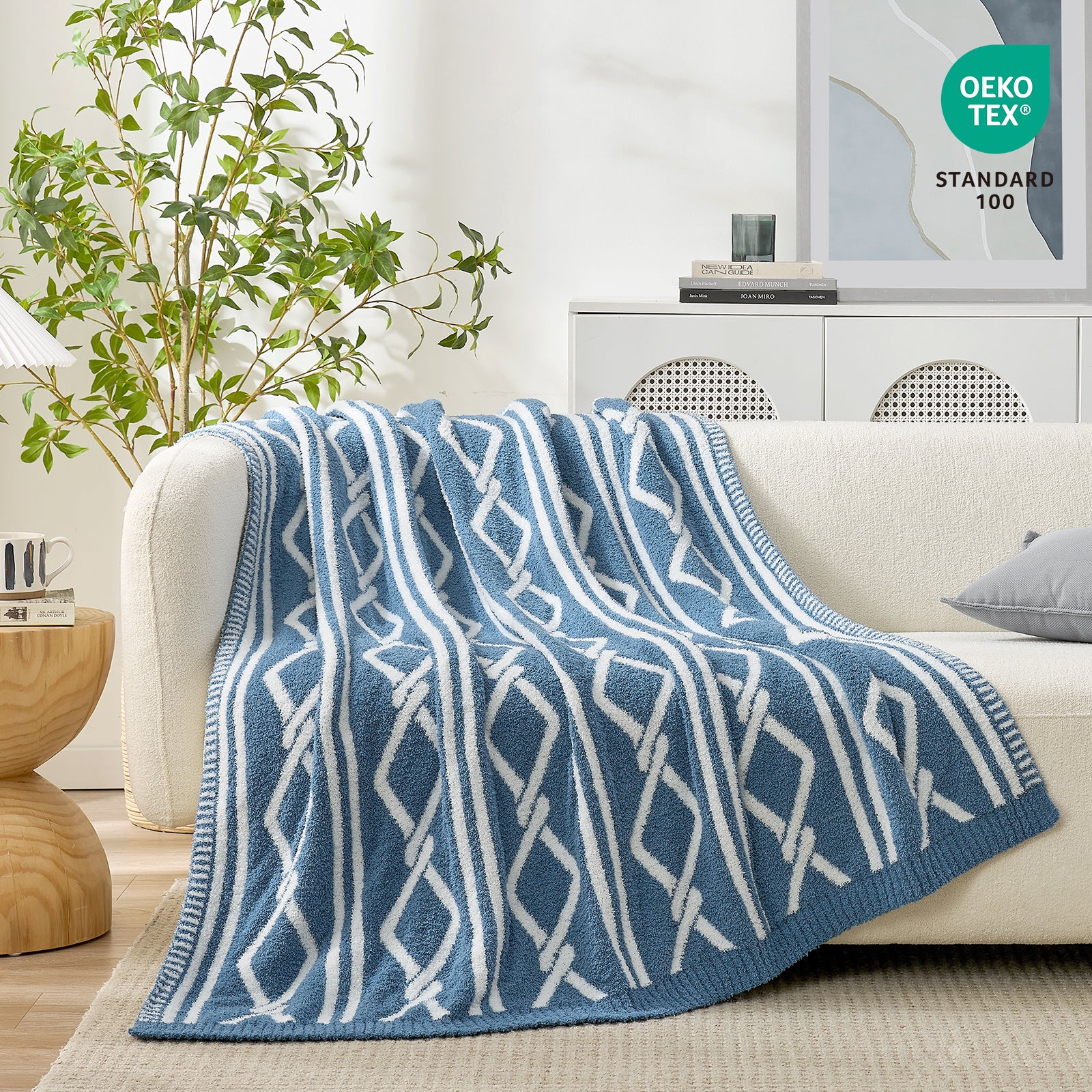 Snuggle Sacs Aesthetic Boho Feather Yarn Knit Throw Blanket on the couch with plants and furnitures behind#color_Blue