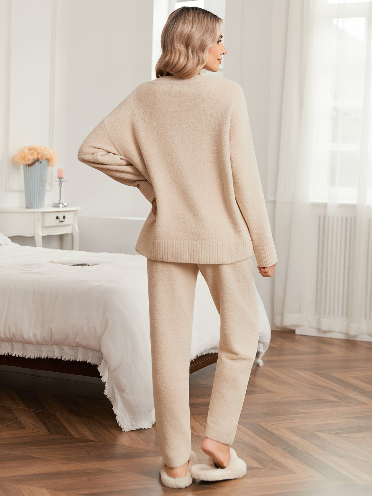 Woman in beige lounge set standing in a bedroom #color_Beige