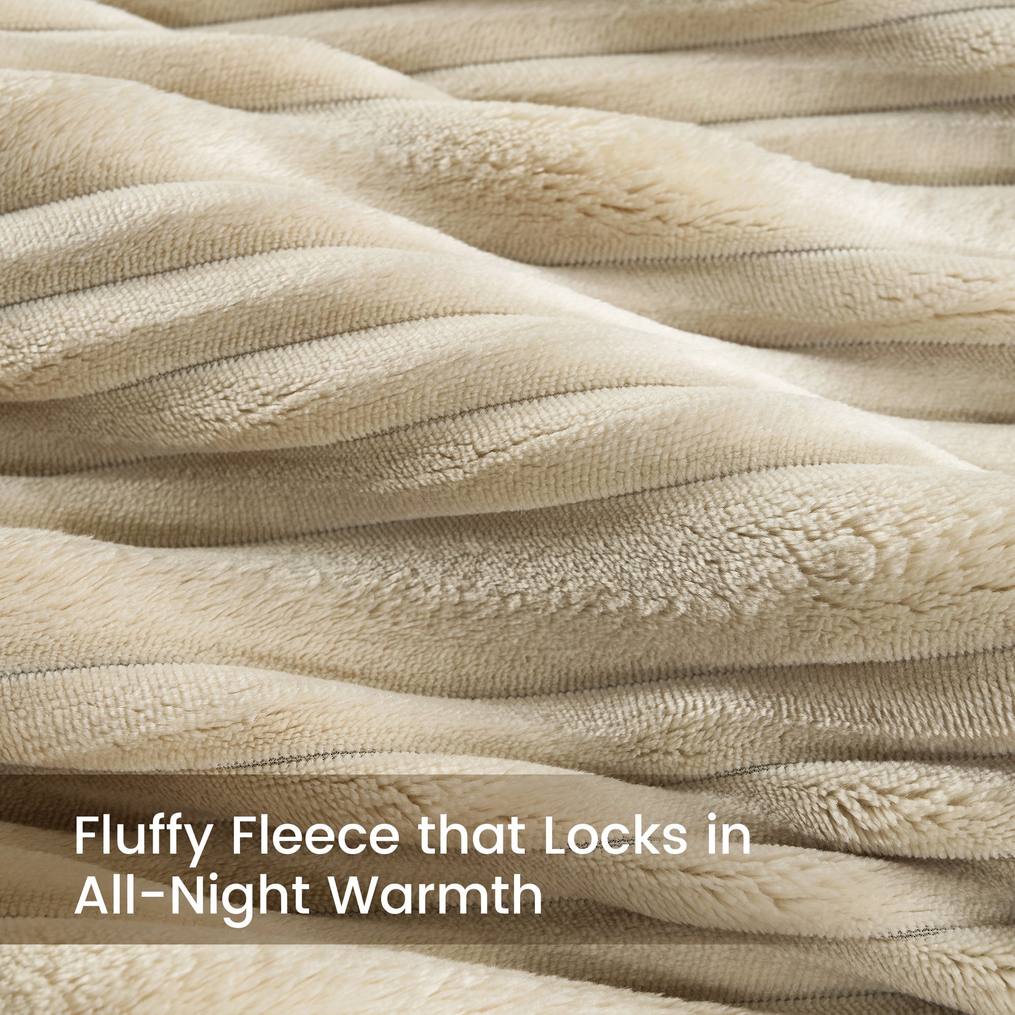 Close-up of fabric with text 'Fluffy Fleece that Locks in All-Night Warmth'.#color_Beige