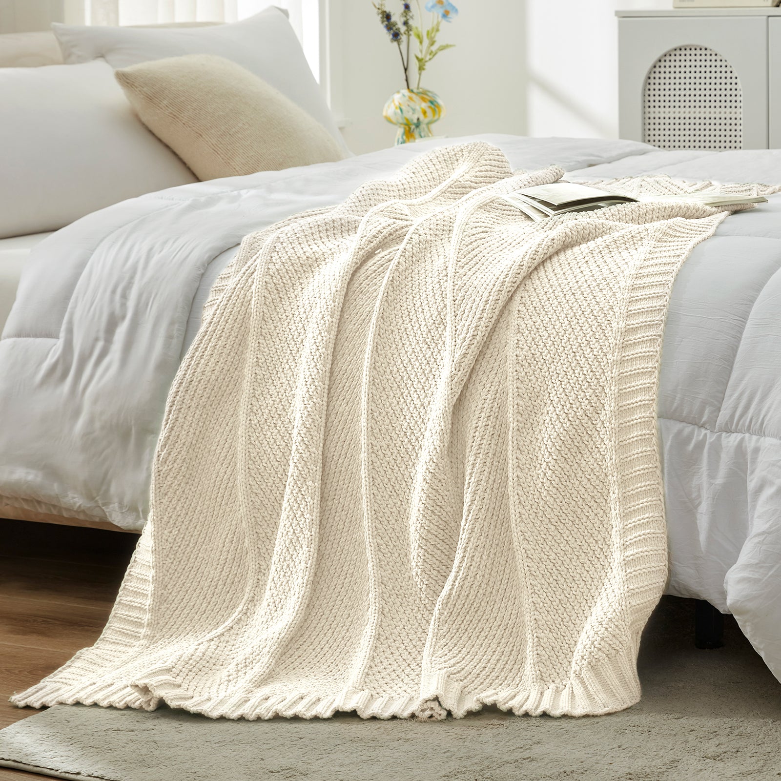 Chevron chenille knit throw blanket in Ivory layered on bed creating a soft and cozy bedroom look #color_Ivory
