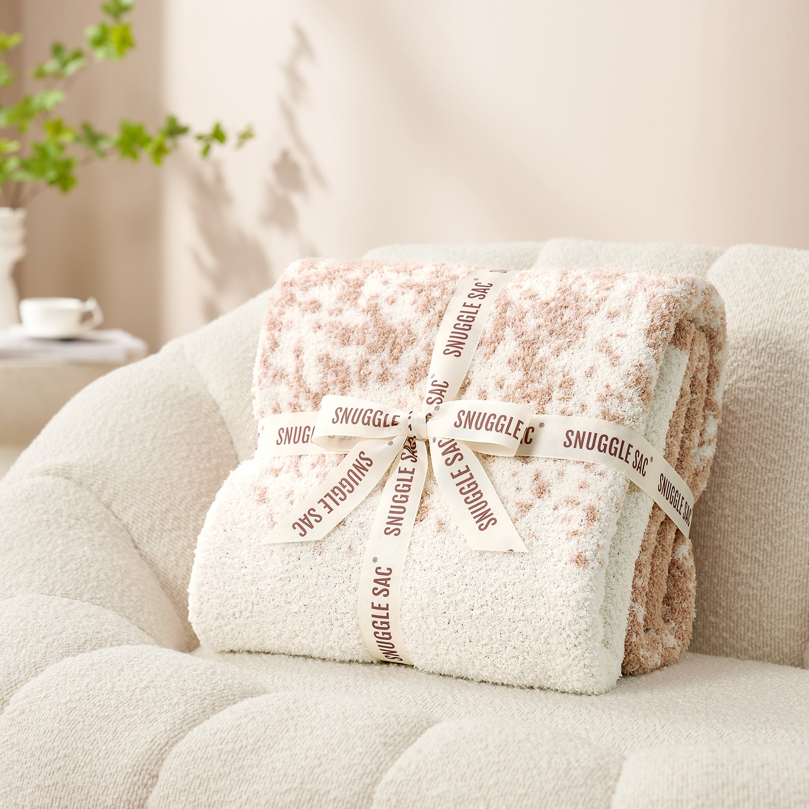 Snuggle Sacs Reversible Ombre Heather Feather Yarn Knit Throw Blanket wrapped as a gift with ribbon#color_Khaki