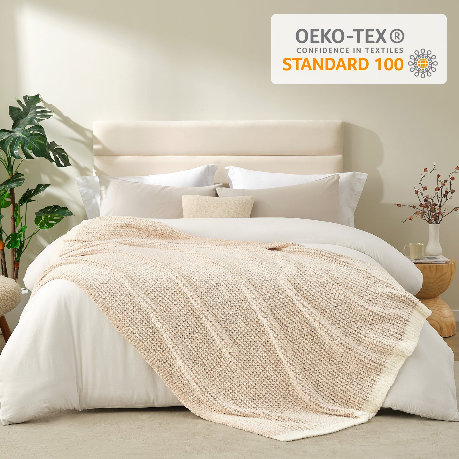 Soft Waffle Feather Yarn Knit Throw Blanket on a bed in a bright room with plants and vase showing OEKO-TEX Certificate#color_Cream/Beige