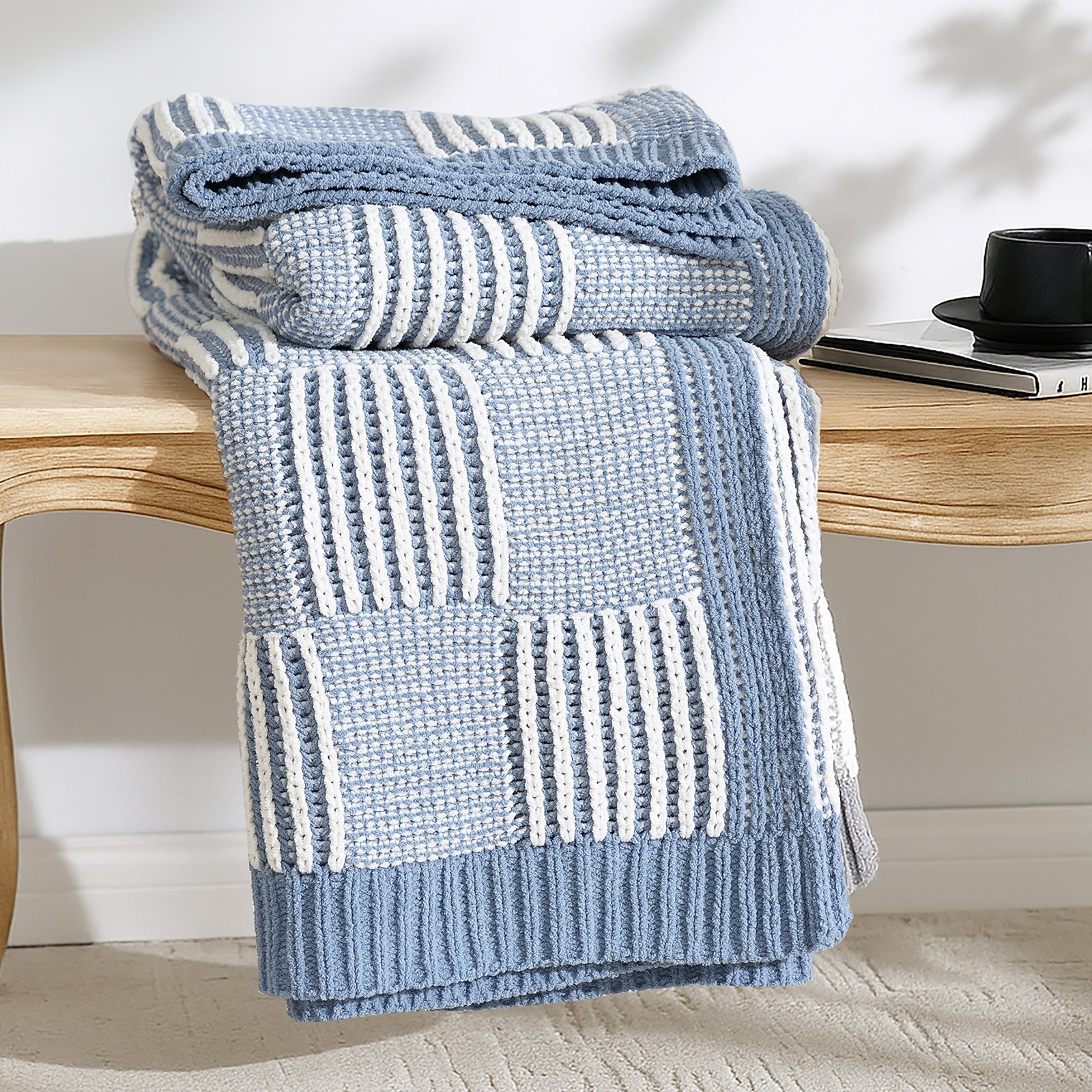 Snuggle Sac two tone checkered chenille knit throw blanket in Blue neatly folded on a wooden table #color_Blue