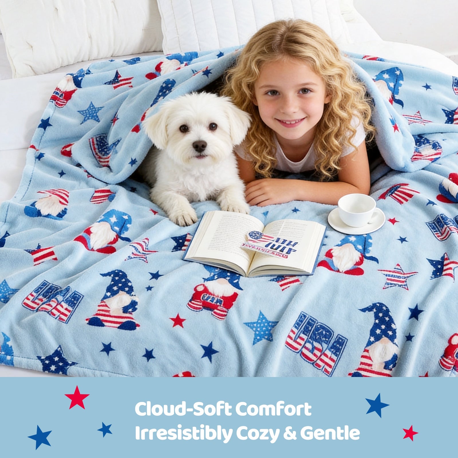 Child and dog under a patriotic-themed blanket with a book and cup on a bed.#color_Blue