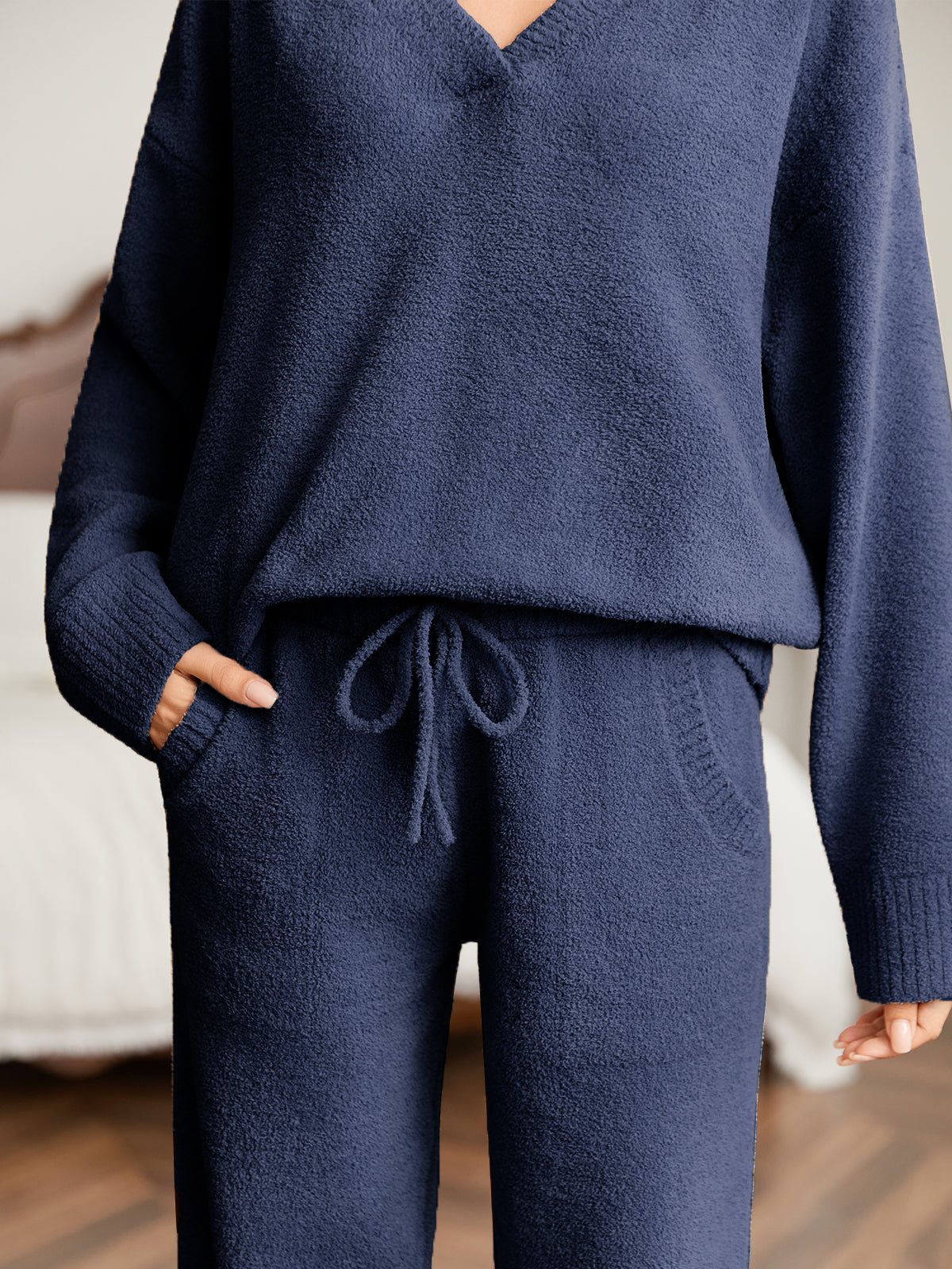 Close up of women long sleeve V-neck knit loungewear set in Navy, showcasing drawstring waist and soft knit fabric #color_Navy