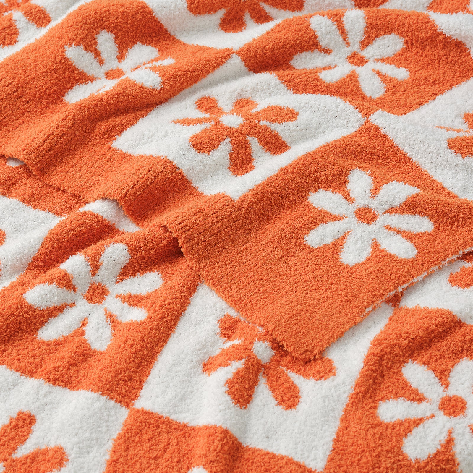 Close-up of orange and white floral patterned fabric #color_Orange