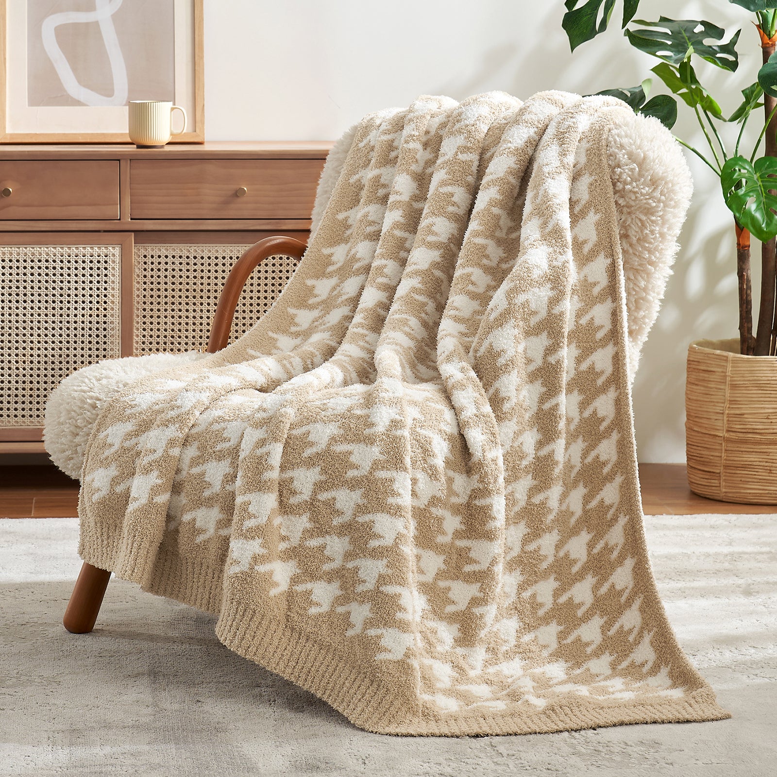 Beige and white patterned blanket draped over a wooden chair in a cozy room. #color_Beige