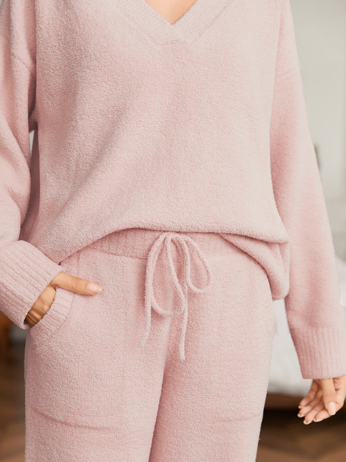 Close up of women long sleeve V-neck knit loungewear set in Pink, showcasing drawstring waist and soft knit fabric #color_Pink
