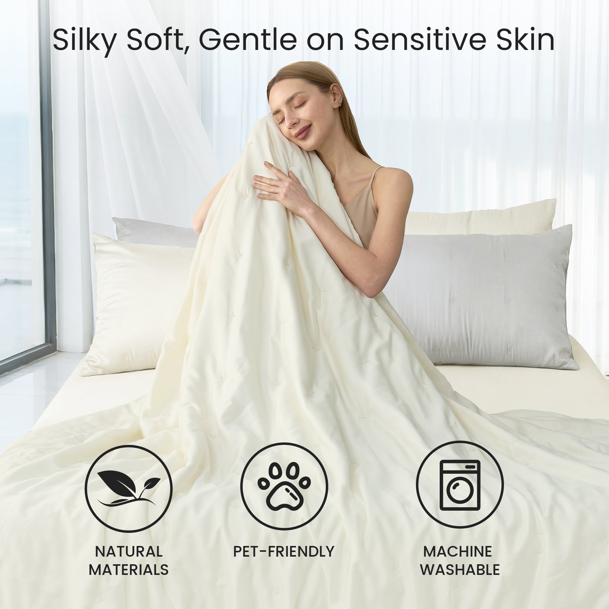 A woman wrapped in Snuggle Sac Cooling comforter sitting on the bed proving Silky Soft, Gentle on sensitive skin#color_White