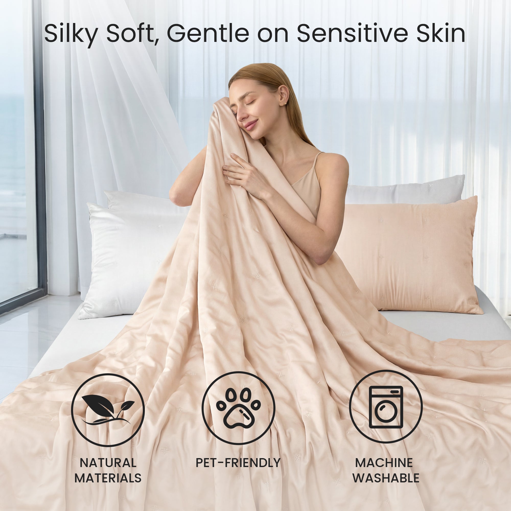 A woman wrapped in Snuggle Sac Cooling comforter sitting on the bed proving Silky Soft, Gentle on sensitive skin#color_Champagne