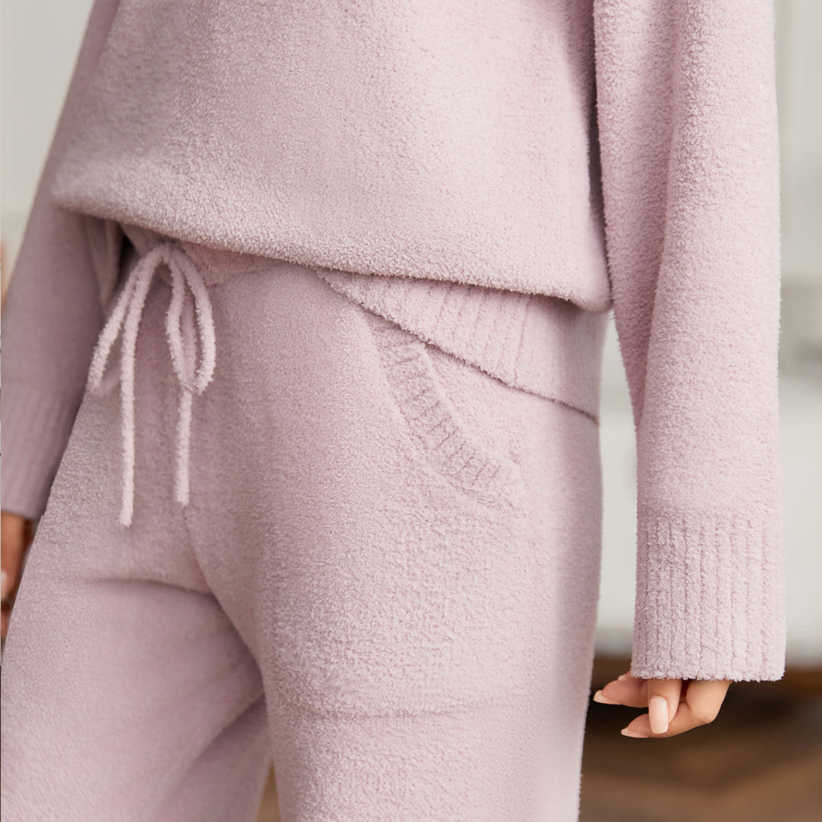 Close up of women long sleeve V-neck knit loungewear set in Taro, showcasing drawstring waist and soft knit fabric #color_Taro