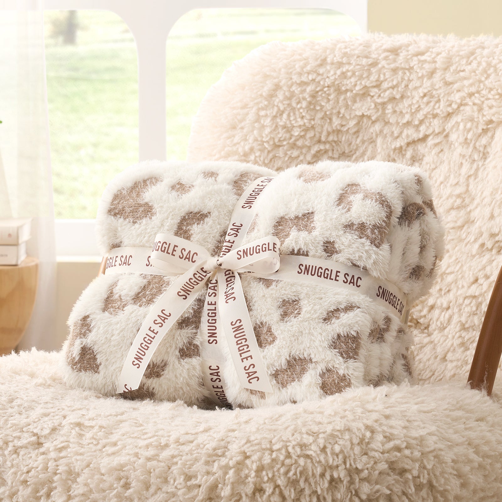 Leopard faux fur knit throw blanket in Leopard Beige folded with ribbon, perfect for gifting #color_Leopard Beige