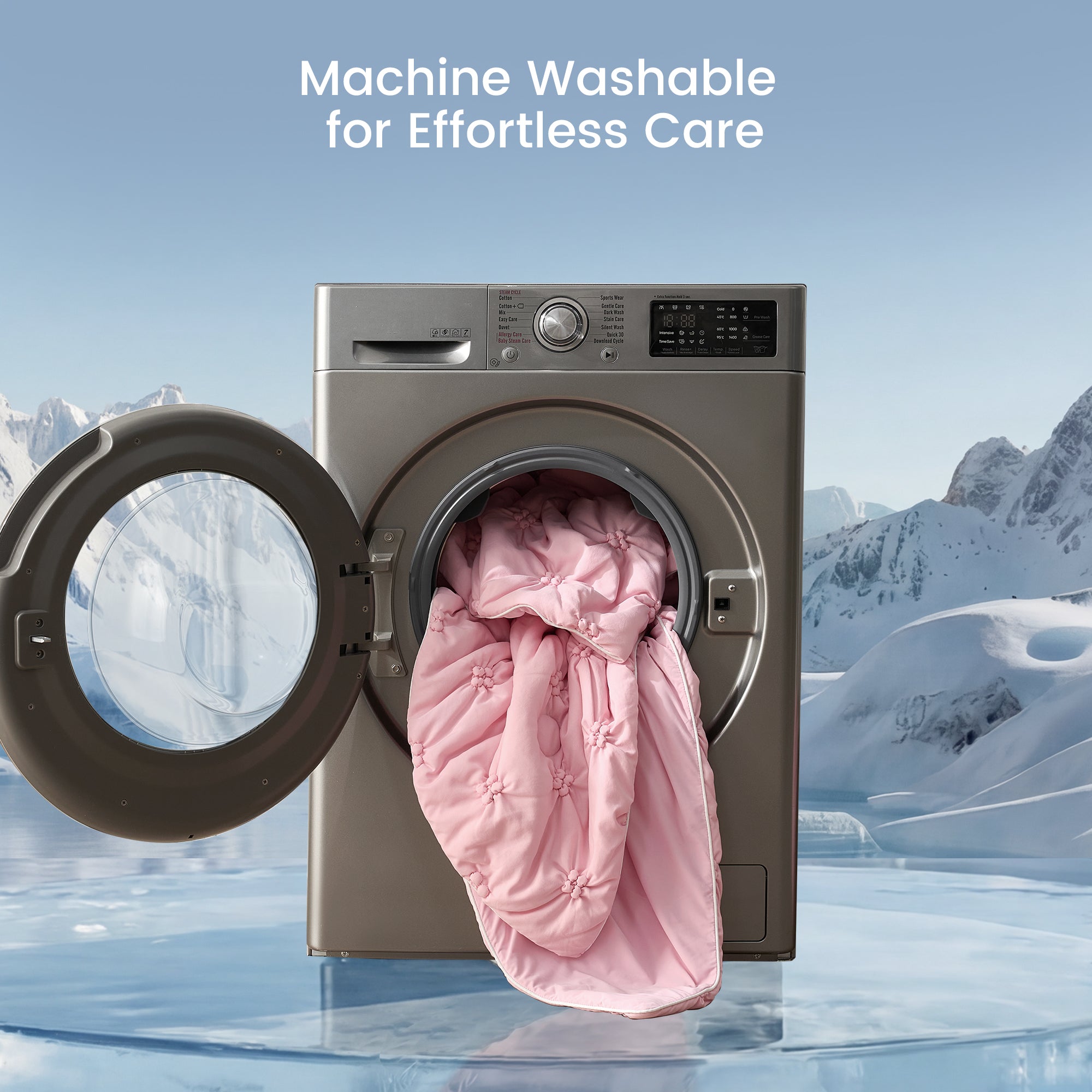 Washing machine with pink comforter inside, set against a snowy mountain landscape.#color_Pink