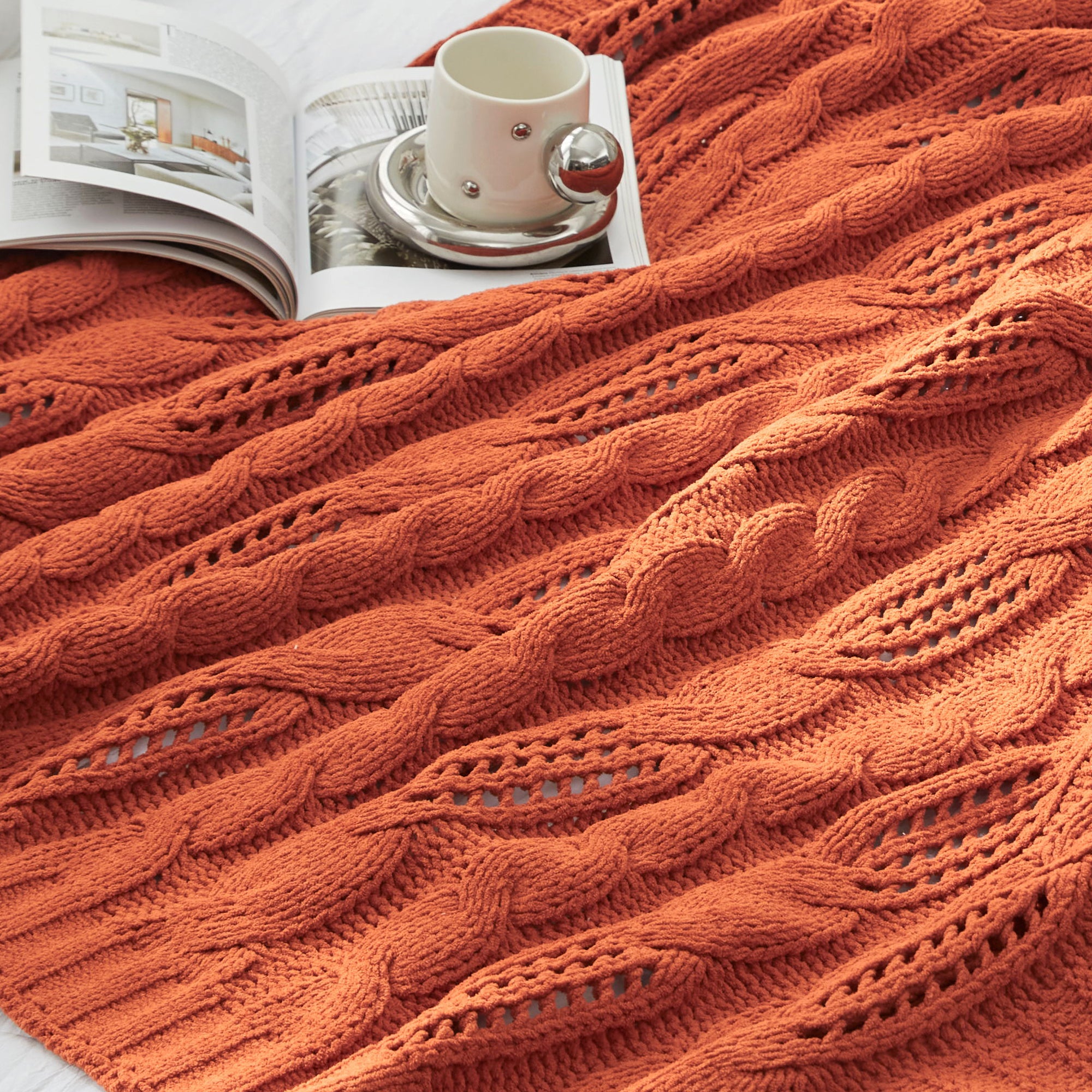 Close up of cable chenille knit throw blanket in Burnt Orange showcasing soft cable knit texture #color_Burnt Orange