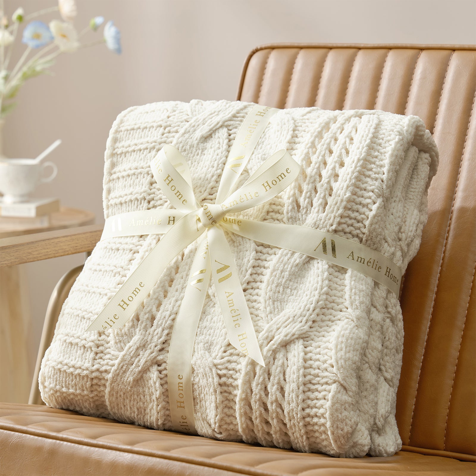 Cable chenille knit throw blanket in Ivory folded with ribbon perfect for gifting #color_Ivory
