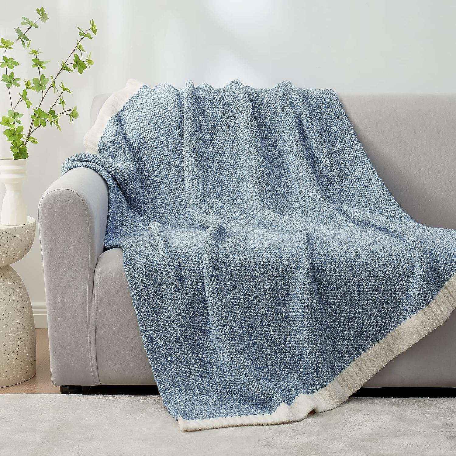 Snuggle Sac Heather Feather Yarn Pale Blue Knit Throw Blanket on the couch#Color_Pale Blue